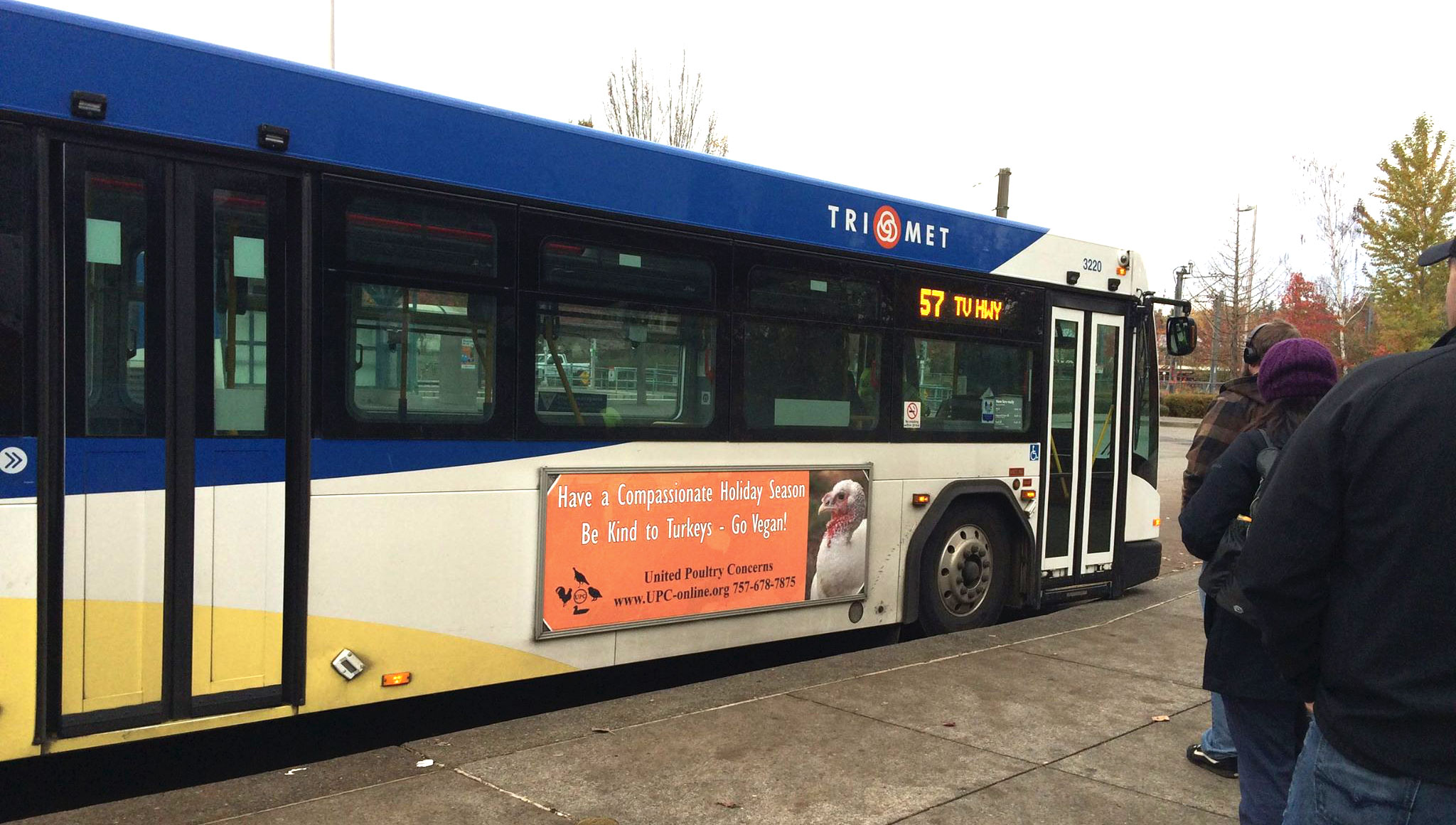 Bus sign: Have a Compassionate Holidy Season. Be Kind to Turkeys - Go Vegan!.