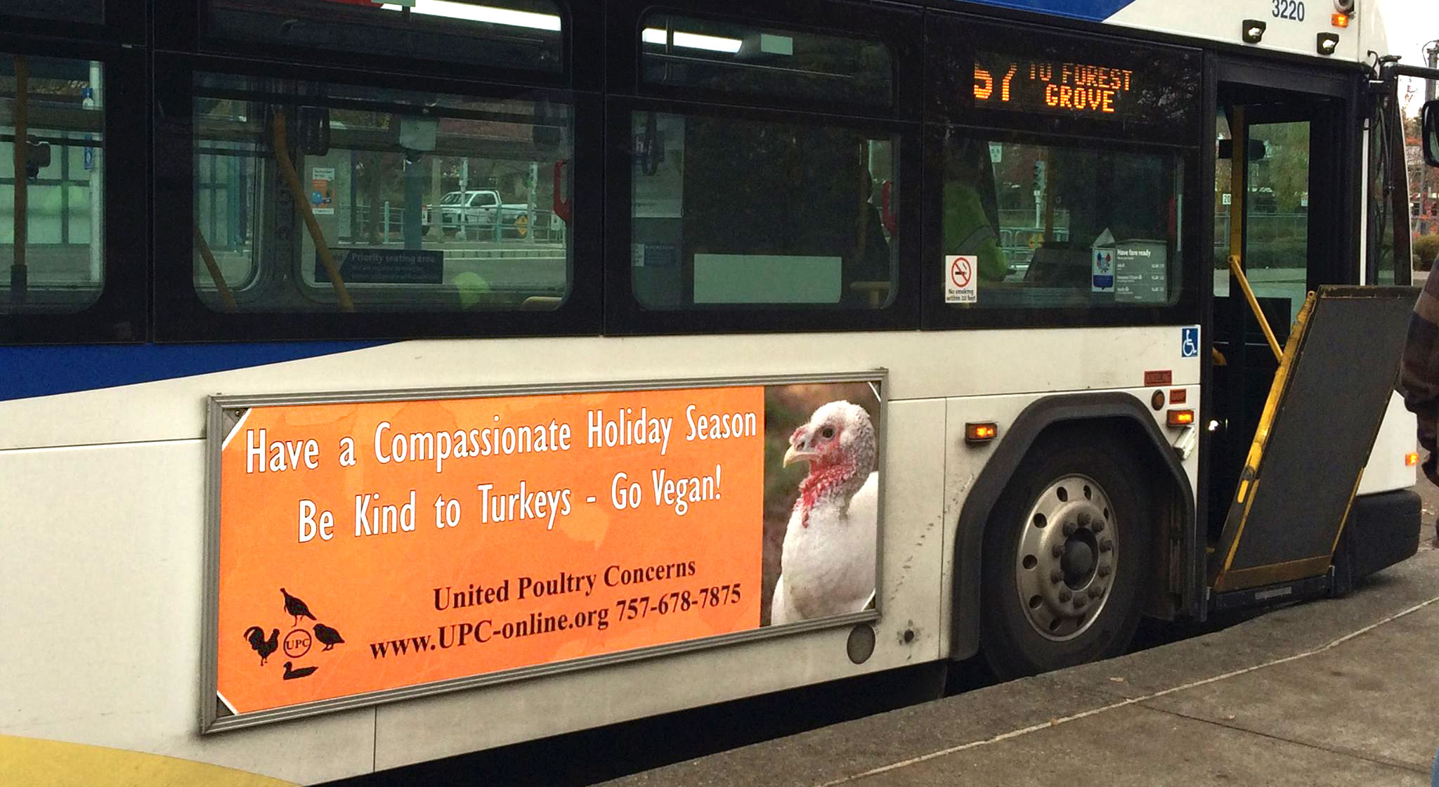 Bus sign: Have a Compassionate Holidy Season. Be Kind to Turkeys - Go Vegan!