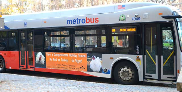 UPC poster on the exterior of a Metro bus