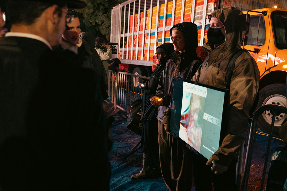 Activists Holding Video Screen