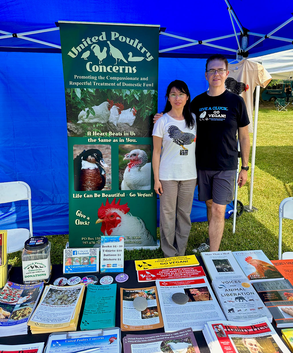 Liqin Cao and Franklin Wade tabling for UPC at the 2023 Lancaster VegFest.