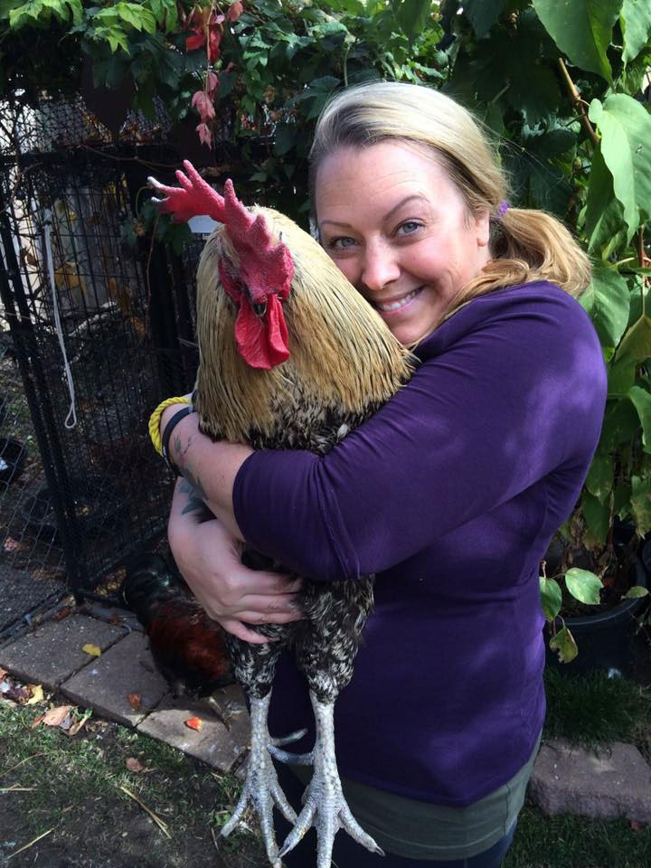 Melanie hugging Butler the rooster